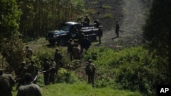Congolese soldiers visit territory that was retaken from M23 rebels, Sept. 6, (AP Photo/Joseph Kay)