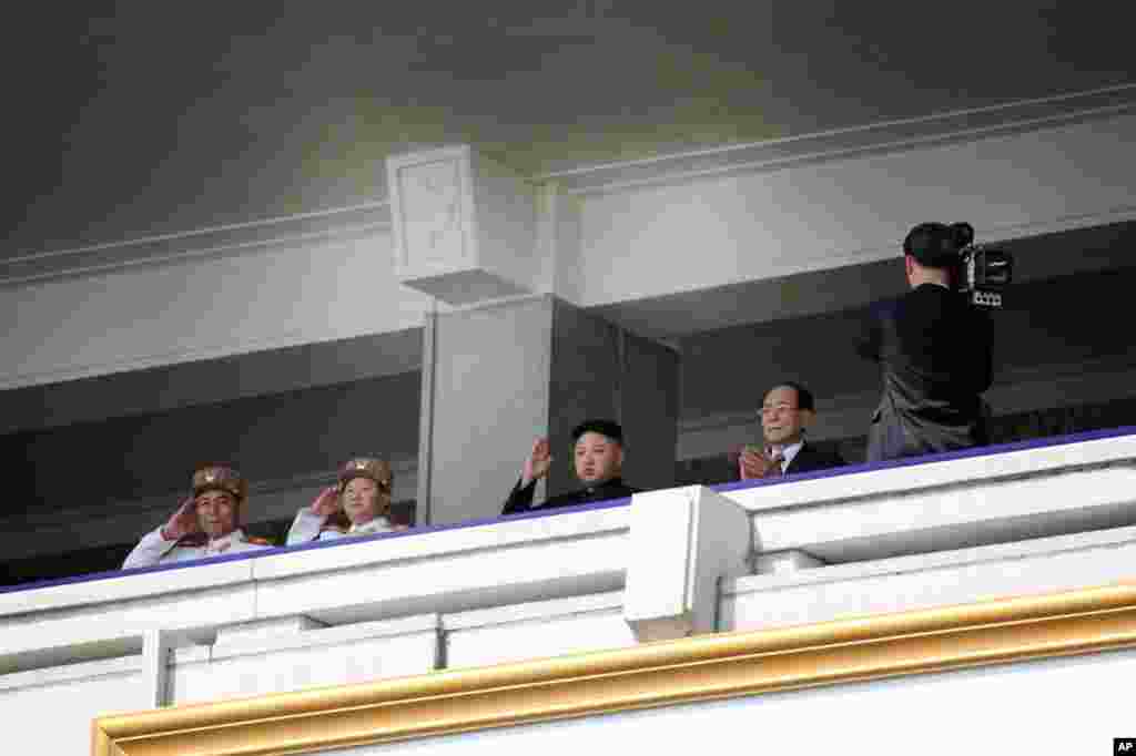 The new North Korean leader, Kim Jong Un (second from right), watches a military parade. (Sungwon Baik/VOA)