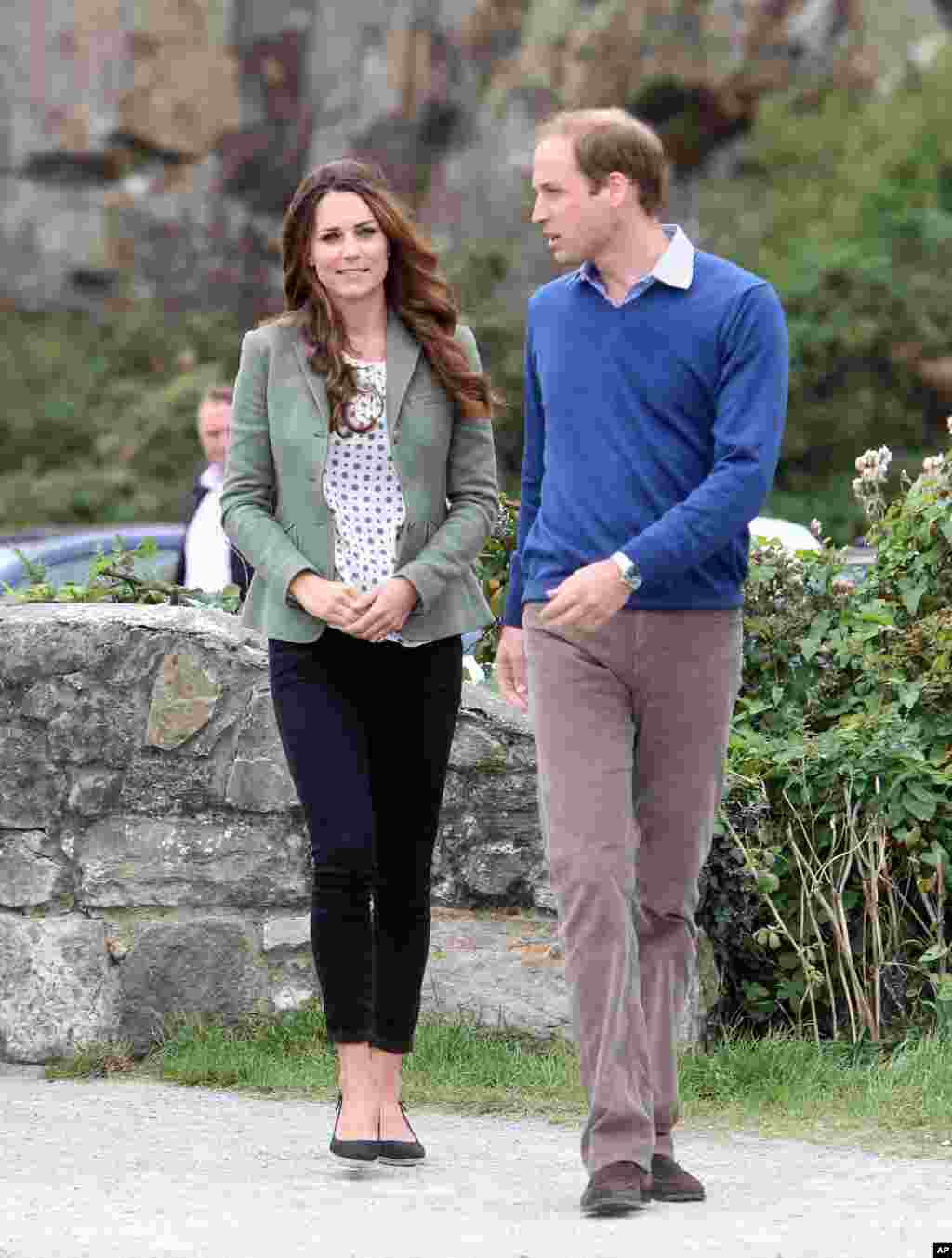 Britain&#39;s Duke and Duchess of Cambridge arrive at Breakwater Country Park for the start of the Ring O&#39; Fire Anglesey Coastal Ultra Marathon, a three-day, 135-mile foot race around the rugged coast of Anglesey, Wales. Kate, Duchess of Cambridge, made her first public appearance since the birth of Prince George as she joined husband Prince William at the event.