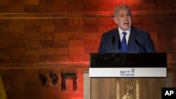 Israeli Prime Minister Benjamin Netanyahu speaks during the Holocaust Remembrance Day ceremony at the Yad Vashem Holocaust memorial in Jerusalem, April 11, 2018.
