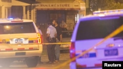 Police investigate the scene of a shooting along Ogden Street in Philadelphia, in the eastern U.S. state of Pennsylvania, June 20, 2015.