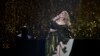 Adele saat tampil di panggung Brit Awards di O2 Arena, London, 8 Februari 2022. 