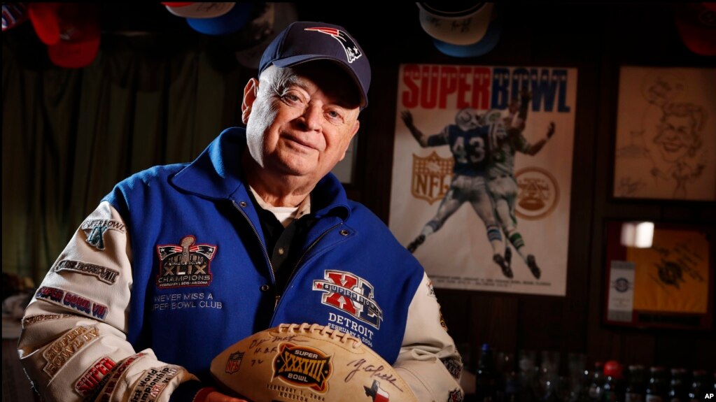 Donald Crisman poses with memorabilia from Super Bowls he has attended so far. Crisman, along with Tom Henschel, and Gregory Eaton have attended every Super Bowl since the first AFL-NFL World Championship held 55 years ago.