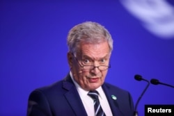 FILE - Finland's President Sauli Niinisto speaks during a conference in Glasgow, Scotland, Britain, Nov. 2, 2021.