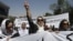 An Afghan protestor shouts slogans during a demonstration in support of female victims of abuse and violence in Kabul, Afghanistan, July 11, 2012.