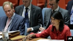 United Kingdom U.N. Ambassador Matthew Rycroft, left, listens as United States U.N. Ambassador Nikki Haley, right, respond to Russia's statements, during United Nations Security Council meeting on North Korea's latest launch of an intercontinental ballist