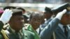 FILE - Zimbabwean President Robert Mugabe (C), surrounded by members of the military, is seen attending 25th anniversary Independence celebrations in Harare, Zimbabwe, April 18, 2005.