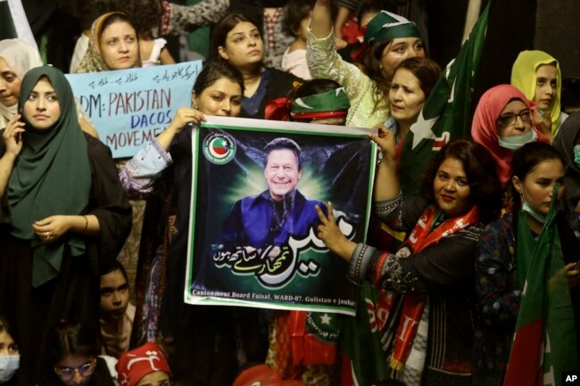 Supporters of Prime Minister Imran Khan's party participate in a rally to condemn the ouster of their leader's government, in Karachi, Pakistan, Sunday, April 10, 2022. (AP Photo/Fareed Khan)