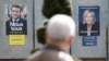 Les affiches de campagne des candidats à l'élection présidentielle française, du président sortant Emmanuel Macron et de la candidate du RN, Marine Le Pen à Denain, le 11 avril 2022. (Photo Ludovic MARIN / AFP)