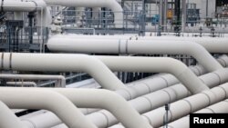 FILE - Pipes are pictured at a gas compressor station in Mallnow, Germany, Nov. 1, 2021.