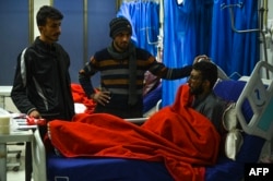 A policeman who was injured in a mosque suicide blast recovers in a hospital in Peshawar, Feb. 1, 2023.