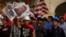 Bearing signs with the photos of the victims of the ongoing political violence, demonstrators march against Peruvian President Dina Boluarte in Lima, Peru, Feb. 1, 2023.