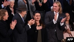 Ukrainian Ambassador to the US Oksana Markarova (C) is applauded after US President Joe Biden acknowledged her during the State of the Union address in the House Chamber of the US Capitol in Washington, DC, on Feb. 7, 2023. 