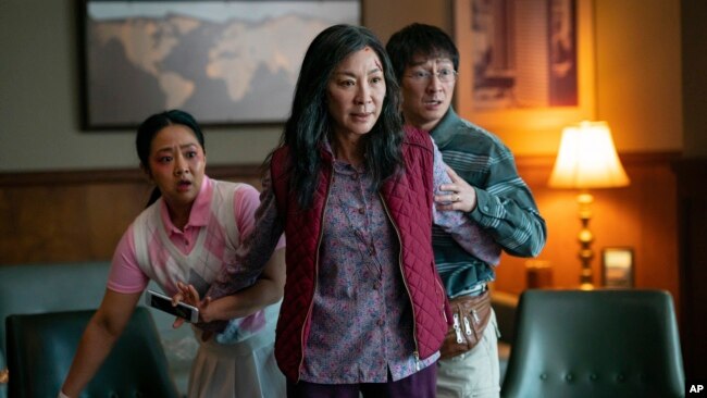 This image released by A24 Films shows, from left, Stephanie Hsu, Michelle Yeoh and Ke Huy Quan in a scene from,