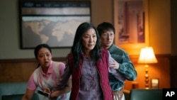 This image released by A24 Films shows, from left, Stephanie Hsu, Michelle Yeoh and Ke Huy Quan in a scene from, "Everything Everywhere All At Once."