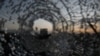 FILE - A building is seen through a bullet hole in a window of the Africa Hotel in the town of Shire, Tigray region, Ethiopia, March 16, 2021.