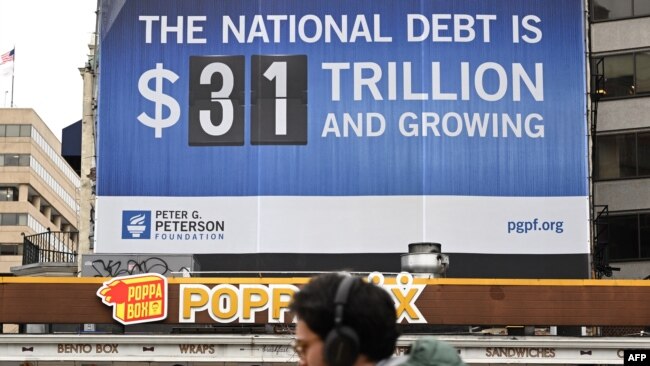 A billboard showing the U.S. national debt is seen in Washington, D.C., Jan. 19, 2023.
