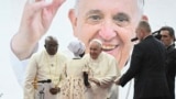 Pope Francis (center) meets an internally displaced person during a meeting at the Freedom Hall in Juba, South Sudan, Feb. 4, 2023. 