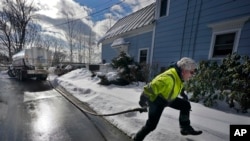 Peter Ellingwood delivers heating oil, Tuesday, Jan. 31, 2023, in Farmington, Maine. On Friday, the U.S. government issues the January jobs report. 