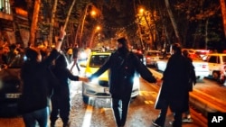 FILE - Women in Tehran, Iran, protest the death of Mahsa Amini in this Oct. 1, 2022, photo taken by an individual not employed by the Associated Press and obtained by the AP outside Iran.