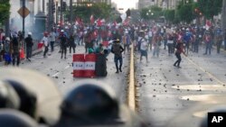 Anti-government protesters clash with police in Lima, Peru, Jan. 24, 2023. 