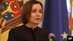Moldovan President Maia Sandu announces she nominated as Prime Minister designate Dorin Recean to form a new government in Chisinau, Moldova, Feb 10, 2023. 