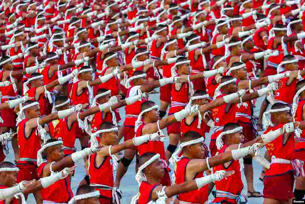 Muay Thai boxers perform the &quot;Wai Khru&quot; to set a Guinness World Record at Rajabhakti Park in Hua Hin, Prachuap Khiri Khan province, Thailand.