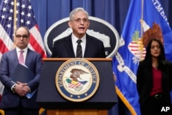 Attorney General Merrick Garland, joined by Associate Attorney General Vanita Gupta and Assistant Attorney General Jonathan Kanter of the Justice Department's Antitrust Division. (AP Photo/Carolyn Kaster)