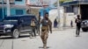 FILE - Security forces patrol at the scene, after gunmen stormed the Hayat Hotel in the capital Mogadishu, Somalia, Aug. 21, 2022. Somalia has launched what is being called the most significant military offensive against the al-Shabab extremist group in more than a decade.