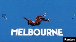 Coco Gauff of the U.S. falls during her fourth round match against Latvia&#39;s Jelena Ostapenko during the Asutralia Open tennis championship in Melbourne, Australia.