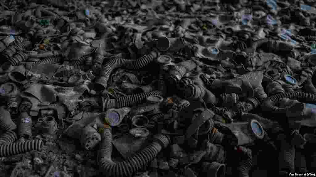 Gas masks left behind in an elementary school in Prypiat, the closest village to the Nuclear Power Plant that exploded in April 1986, in Chernobyl, Ukraine, Jan. 31, 2023 (VOANEWS/Yan Boechat)