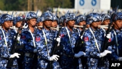 FILE - Members of the Myanmar military march at a parade ground to mark the country's Independence Day in Naypyidaw on Jan. 4, 2023.