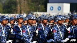 FILE - Members of the Myanmar military march at a parade ground to mark the country's Independence Day in Naypyidaw on Jan. 4, 2023.