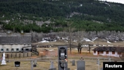A marker notes the site of the former St. Joseph's Mission Residential School, where a sweep in 2021 had indicated 93 possible burial sites, in Williams Lake, British Columbia, March 29, 2022. Sixty-six more have recently been discovered. 