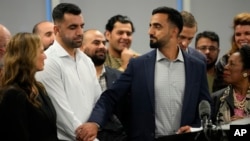 Abdul Wasi Safi, center, acknowledges his brother, Sami-ullah Safi, left, during a news conference in Houston, Texas, on Jan. 27, 2023. Other supporters — including U.S. Representative Sheila Jackson Lee of Texas at right — also celebrated Wasi Safi's freedom. 