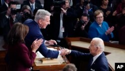 U.S. President Joe Biden arrives and shakes hands with House Speaker Kevin McCarthy of California before he delivers his State of the Union speech to a joint session of Congress at the Capitol in Washington, Feb. 7, 2023.