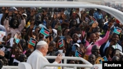 FILE - Pope Francis greets people during the Holy Mass at John Garang Mausoleum during his apostolic journey, in Juba, South Sudan, Feb. 5, 2023.