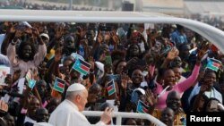 FILE: Pope Francis greets people during the Holy Mass at John Garang Mausoleum during his apostolic journey, in Juba, South Sudan, February 5, 2023.