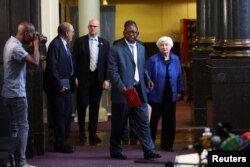 U.S. Treasury Secretary Janet Yellen and South Africa's Finance Minister Enoch Godongwana arrive for media briefing, at the treasury offices in Pretoria, South Africa, Jan. 26, 2023.