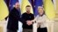 Ukrainian President Volodymyr Zelenskyy, center, European Commission President Ursula von der Leyen, right, 