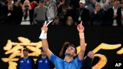 Novak Djokovic of Serbia celebrates after defeating Stefanos Tsitsipas of Greece in the men's singles final at the Australian Open tennis championship in Melbourne, Australia, Jan. 29, 2023.