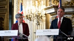 Australian Foreign Minister Penny Wong listens to Australian Defense Minister Richard Marles speaking during a press conference after a joint meeting with their French counterpart at Quai d'Orsay in Paris, Jan. 30, 2023.