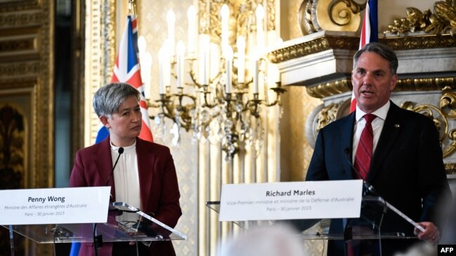 Australian Foreign Minister Penny Wong listens to Australian Defense Minister Richard Marles speaking during a press conference after a joint meeting with their French counterpart at Quai d'Orsay in Paris, Jan. 30, 2023.