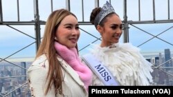 Anne Jakkaphong Jakrajutatip (left), owner of Miss Universe Organization, poses with Miss Universe 2022 R'Bonney Gabriel (right) poses during a press session at 86th floor observation deck, Empire State Building, New York City