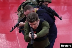 FILE - Men take part in an initial military training for civilians at the sports and patriotic club "Yaropolk" in Krasnogorsk outside Moscow, Russia, Dec. 3, 2022.