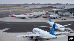 Planes sit on the tarmac at Terminal B at LaGuardia Airport in New York, Jan. 11, 2023. 