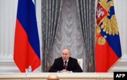 Russian President Vladimir Putin chairs a meeting with secretaries of foreign security councils on Afghan issues at the Kremlin in Moscow, Feb. 8, 2023.