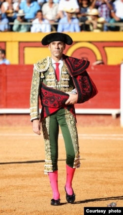 Bullfighter José Tomas with a 'capote de paseo' - the red cape - made by tailor Enrique Vera. (Courtesy: Enrique Vera)