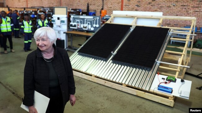 U.S. Treasury Secretary Janet Yellen stands next to a solar panel station, during a visit to the coal mining region of Mpumalanga, South Africa, Jan. 27, 2023.