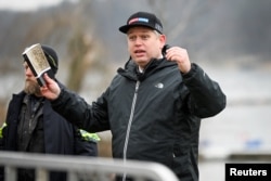 Rasmus Paludan, leader of the far-right Danish political party Stram Kurs, speaks outside the Turkish embassy in Stockholm, Sweden, Jan. 21, 2023. (Fredrik Sandberg/TT News Agency/via Reuters)